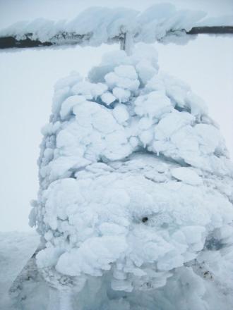 Ice coats a Jet Ranger helicopter that became stranded on the summit of Mount Mageik near the Valley of 10,000 Smokes in early September 2013. Sam Egli, the owner of the helicopter, later flew up with another helicopter and a mechanic who thawed this helicopter. Egli eventually flew this helicopter back to his base in King Salmon. Photo by Taryn Lopez