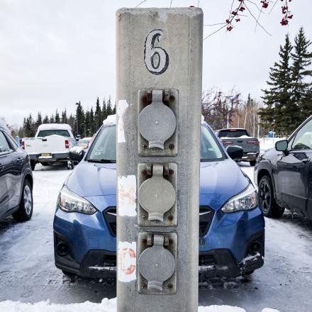 This kind of block heater outlet can accomodate THREE cars if one car is parked right in front of it.