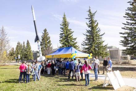 Vistors queue up for ice cream in front of the rocket during the 2023 Arctic Research Open House May 18, 2023 at the Troth Yeddha' campus in Fairbanks. UAF/GI photo by JR Ancheta.