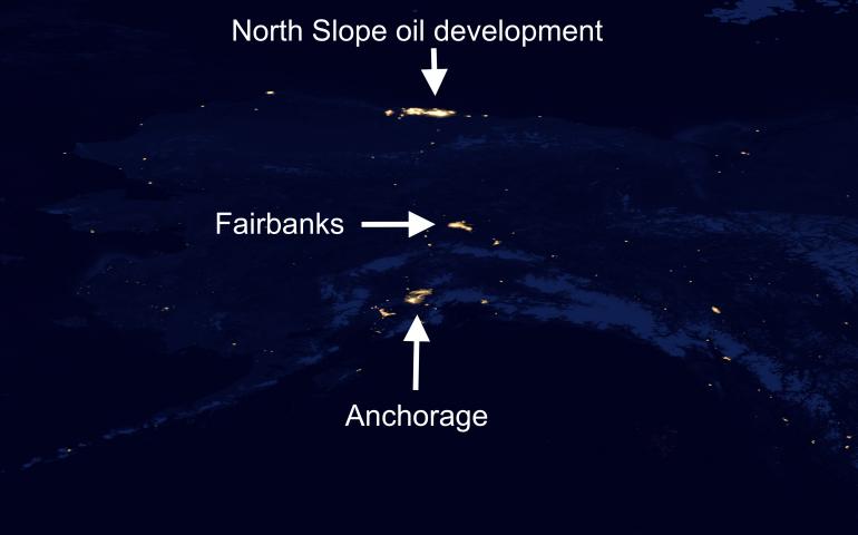 Alaska at night, showing a good deal of blackness that represents undisturbed habitat for many non-human creatures. NASA Earth Observatory, public domain image.