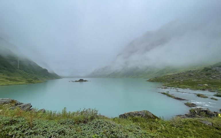 A steady rain falls on Allison Lake, a basin perched above Valdez in the Chugach Mountains. Photo by Ned Rozell.