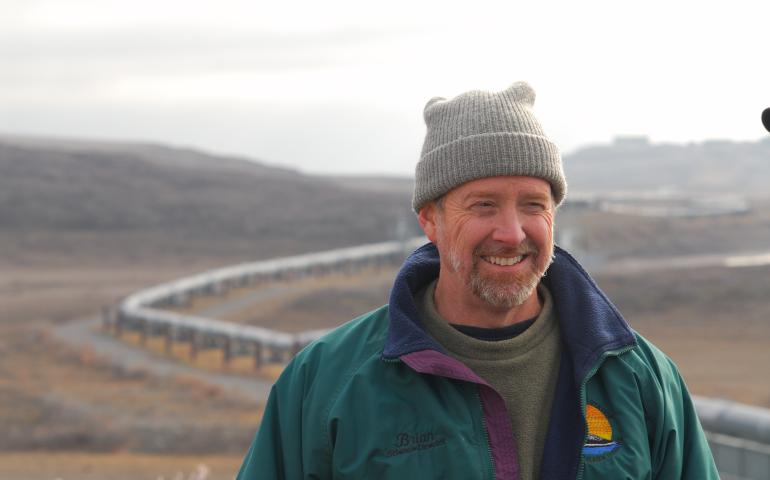 Brian Barnes listens to a colleague while studying ground squirrels near the trans-Alaska pipeline north of the Brooks Range on Sept. 21, 2007. Photo by Øivind Tøien.