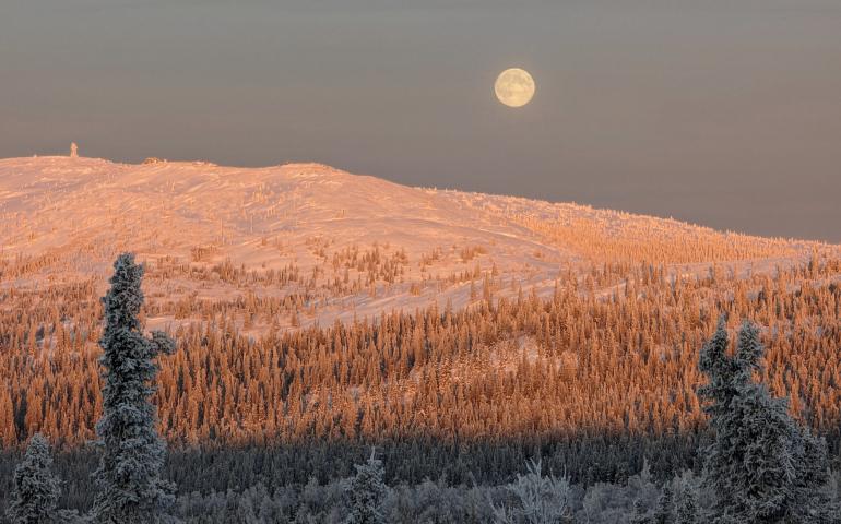 John Eichelberger of Fairbanks took this photo of the full moon on Dec. 26, 2023, north of Fairbanks. At the time he took this photo — solar noon in Fairbanks or about 1 p.m. local time — the full moon appeared due north of him. Photo by John Eichelberger.