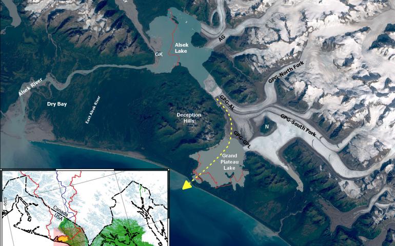 A satellite image showing the Alsek River and Grand Plateau Glacier in southern Alaska. The yellow dashed line represents where the Alsek River may soon flow due to extreme melting of Grand Plateau Glacier (labeled GPG). In the early 1900s, Alsek Glacier (AG) was connected to Grand Plateau Glacier. 