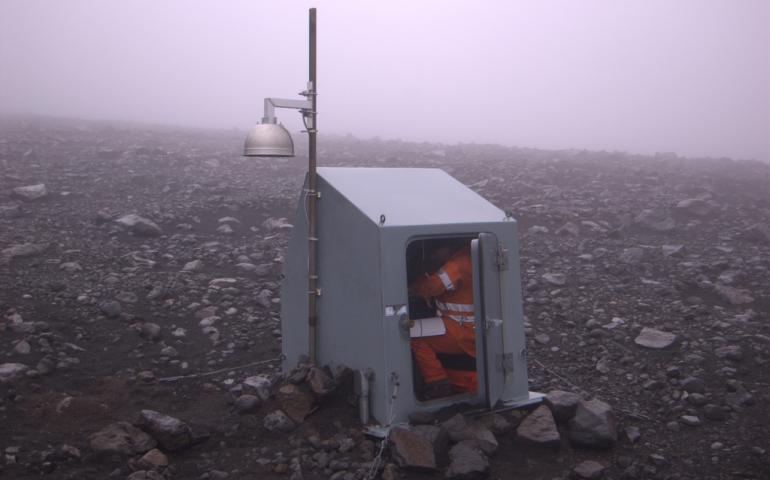 Guy Tytgat in a seismic-station hut near Pavlof Volcano in 2007. Alaska Volcano Observatory photo by Cyrus Read.