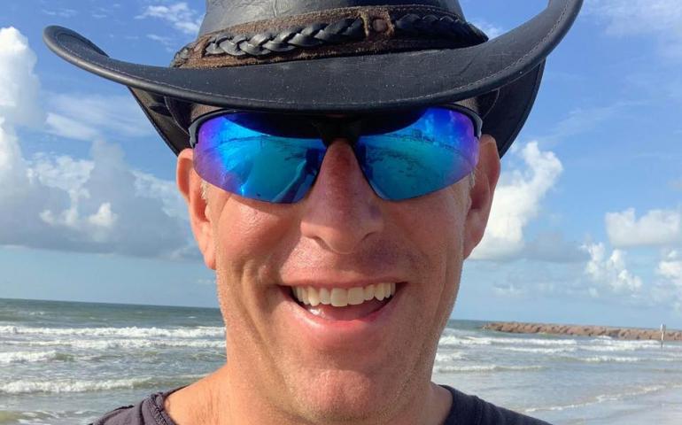 “Hurricane Hal” Needham smiles on a benign day on a Galveston, Texas, beach. The extreme weather and disaster scientist for CNC Catastrophe & National Claims recently drove to a parking garage in southwest Florida to document Hurricane Ian. Photo courtesy Hal Needham.