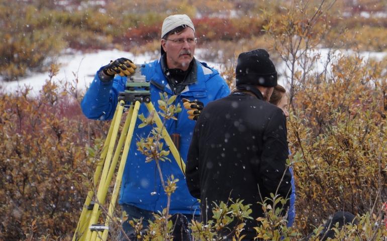 Jeff Freymueller works with GPS equipment at Chandalar Shelf in the Brooks Range in late August 2015. Photo by John Farrell.