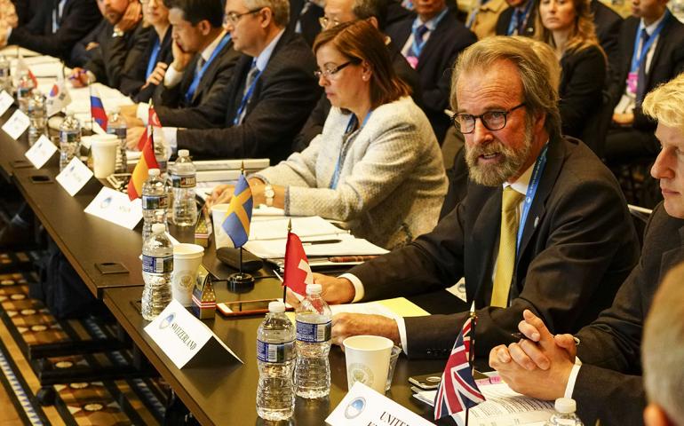 Konrad Steffen, wearing glasses and a yellow tie, at the White House in 2016, where he represented Switzerland at the first Arctic Ministerial Conference. Photo courtesy Swiss Federal Institute for Forest, Snow and Landscape.