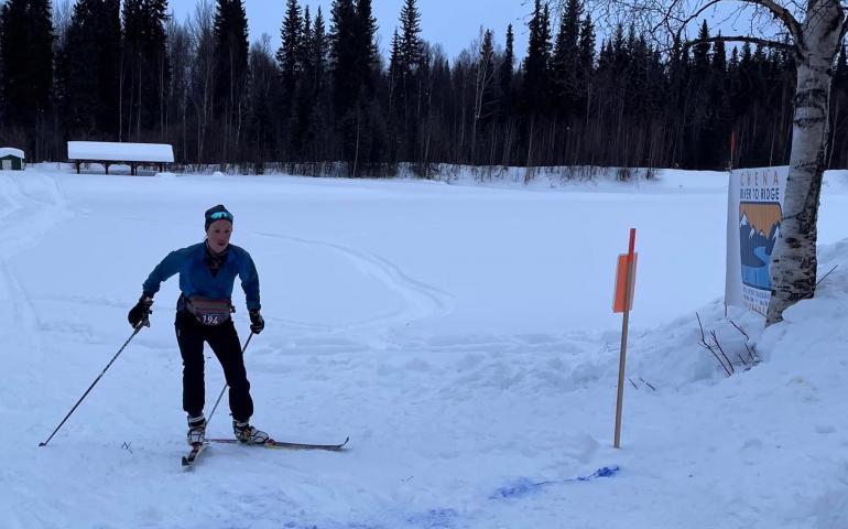 Shalane Frost skis the last few feet of a 55-mile course to win the ski division of the Chena River to Ridge Race east of Fairbanks on March 5, 2022. Corrine Leistikow photo.