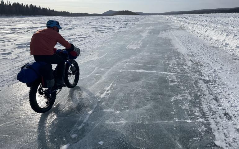 Ned Rozell rides a plowed winter road on the Yukon River that allows cars and trucks to drive between Manley Hot Springs and the village of Tanana in the winter. Photo by Forest Wagner.
