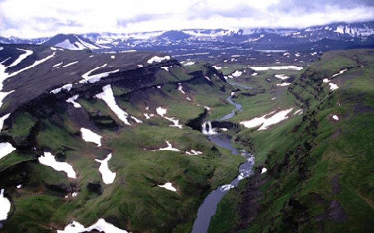  The entrance along Crater Creek to the rising crater on top of Okmok Volcano. Okmok is located on Umnak Island in the Aleutians. Photo by Doerte Mann. 