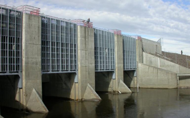  Chena River Lakes Flood Control Project manager John Schaake stands on top of flood gates that control the flow of the Chena River. The flood control project, located 40 river miles upstream of Fairbanks, has saved Fairbanks from flooding several times since its completion in 1979. Ned Rozell photo. 