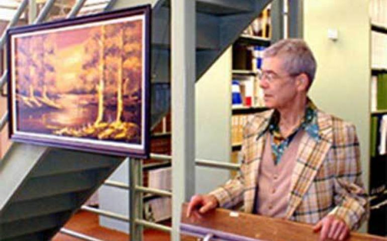  Jim Anderson poses next to one of his 300 junk store artworks in the University of Alaska Fairbanks’ Biosciences Library in 2004. Photo courtesy of Tom Delaune. 