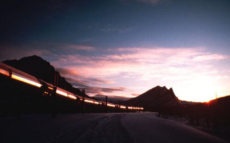  The trans-Alaska oil pipeline reflects the glow of a winter sunset. Photo courtesy Alaska Division of Community and Business Development. 