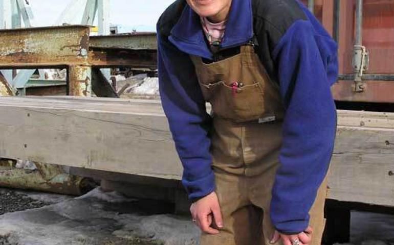 Raven researcher Stacia Backensto disguises herself as an oilfield worker in an attempt to fool ravens she has captured before. Photo by Jim Zelenak. 