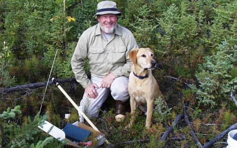  Tom Osterkamp with his Labrador retriever Happy at a permafrost-monitoring site near Bonanza Creek west of Fairbanks in 1999. Photo courtesy Tom Osterkamp. 