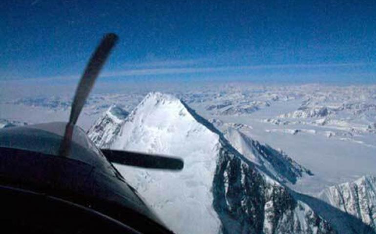  Paul Claus flies over the summit of Mt. St. Elias in his turbine Otter in 2008 as Chris Larsen measures its elevation. Photo by Chris Larsen. 
