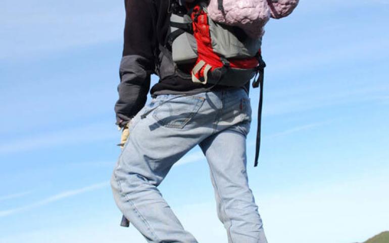  Dinosaur researcher Tony Fiorillo packs out a cast of a hadrosaur footprint in Denali National Park and Preserve, a hotspot for dinosaur research. Photo by Yoshi Kobayashi. 