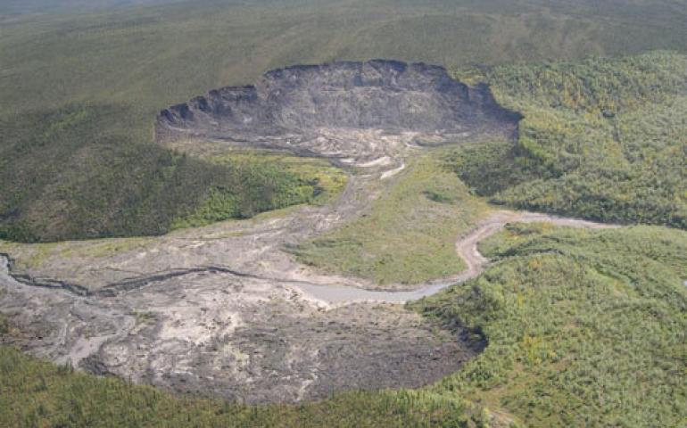  A double progressive thaw slump on both sides of the Caribou River, which flows into the Peel River in northern Yukon Territory. It is located at about the same latitude as the Selawik Slump. Photo by Doug Davidge. 