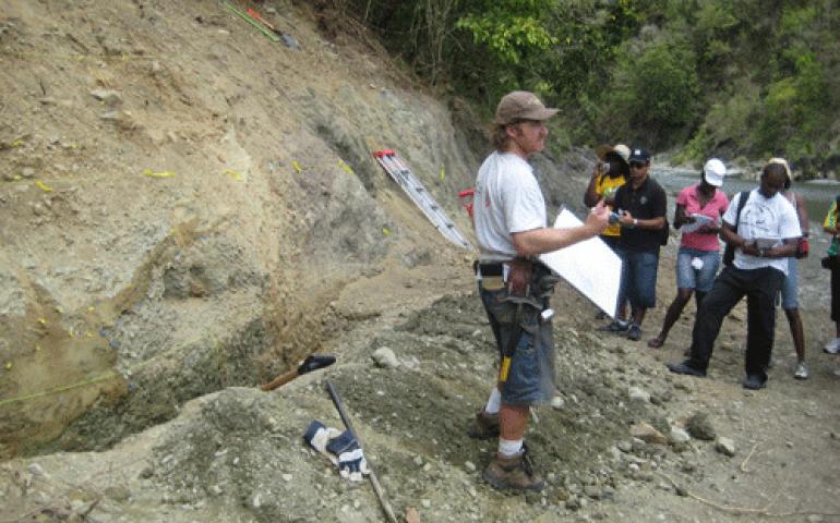  Rich Koehler of the Alaska Division of Geological and Geophysical Surveys lectures to students in Jamaica in March 2009 along a surface expression of the Plaintain Garden fault system, part of the boundary between Earth’s plates that slipped, causing the 2010 Haiti earthquake. Photo by Paul Mann. 