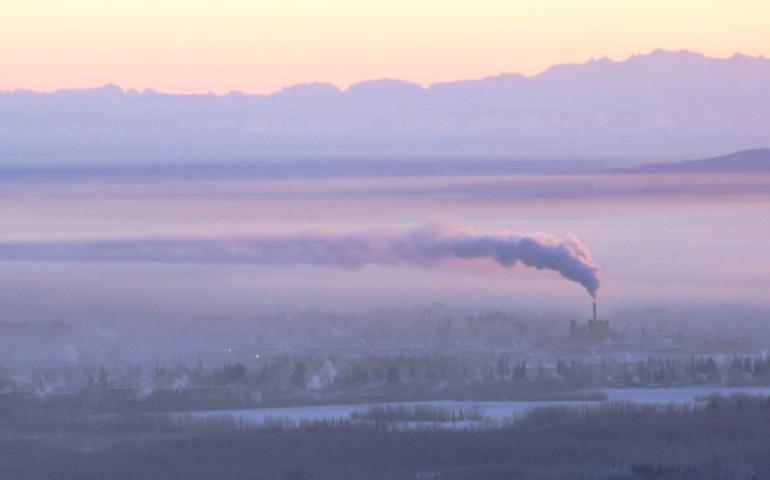 Downtown Fairbanks is blanketed in ice fog beneath the exhaust of a coal-fired power plant in January 2012. Photo by Ned Rozell.