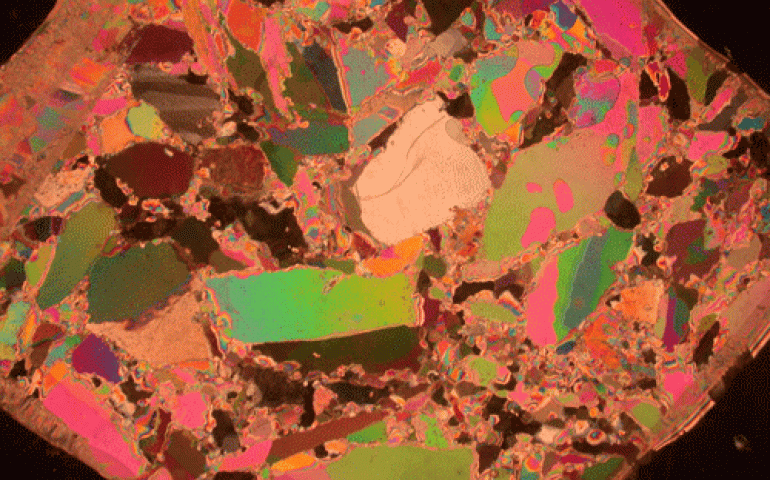 Sea ice made by Marc Mueller-Stoffels, who suspended chunks of fresh-water ice in salty brine at below-zero temperatures. He took this photo of a thin cross-section of ice using a polarizing filter. Individual shapes are ice crystals. Photo by Marc Mueller-Stoffels