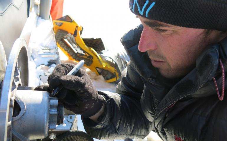 A scientist using equipment. 