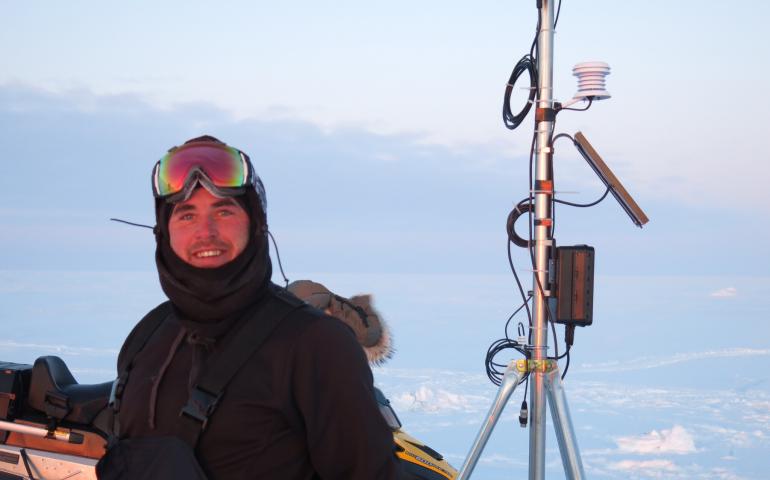 Photograph of scientist at "Teshekpuk Lake Observatory". 