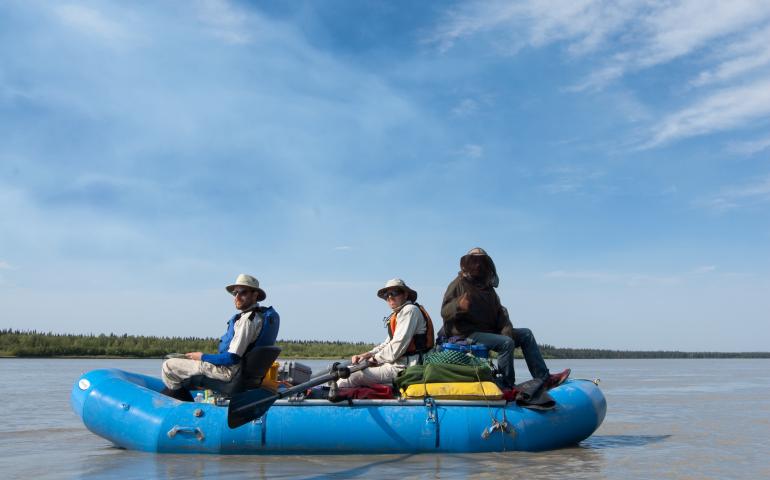 Carl Tape, Michael West, Matt Gardine, and Celso Alvizuri travel by raft on the Tanana River to install motion detectors in the Minto Flats seismic zone.