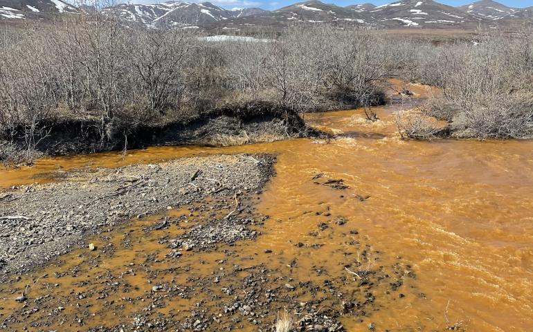 Josh Koch took this photo of the Kugororuk River in northern Alaska in June 2023. The orange stream color reflects oxidized iron, but also often indicates elevated heavy metal concentrations. Photo by Josh Koch.