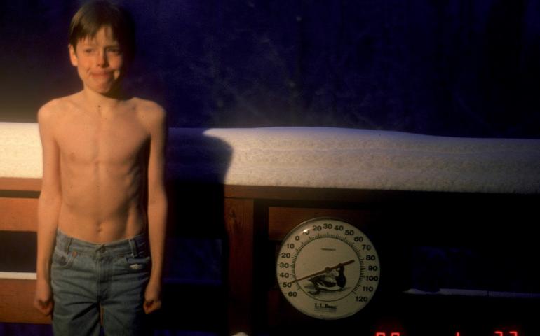 A 9-year-old Carl Tape — now a seismologist at UAF’s Geophysical Institute — poses beside a thermometer registering 50 below zero Fahrenheit during a Fairbanks cold snap in January 1989. Photo by Walt Tape.
