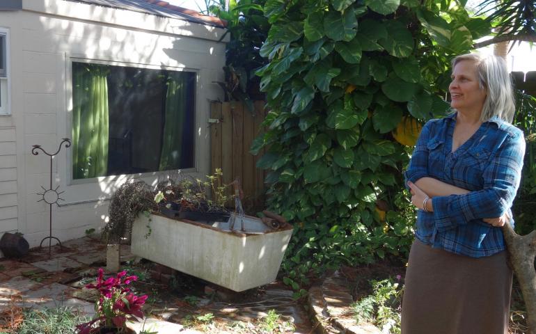Deb Long in the courtyard outside her New Orleans home. 