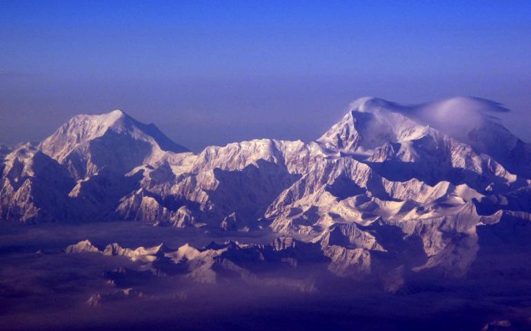 The snow-capturing peaks of the Alaska Range, including 17,400 foot Mount Foraker, left, and 20,320 foot Mount McKinley. Photo by Ned Rozell.