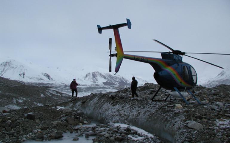  USGS geologist Peter Haeussler uses a satellite phone to tell a seismologist about the discovery of the Susitna Glacier fault on Nov. 10, 2002. Photos courtesy of Peter Haeussler, U.S. Geological Survey 