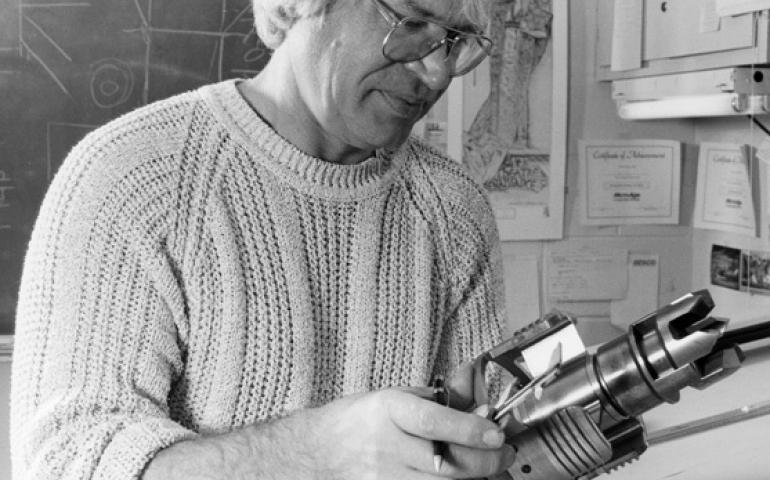  Larry Kozycki holds part of the drill he developed to penetrate the Greenland ice cap. Photo by Evelyn Trabant. 