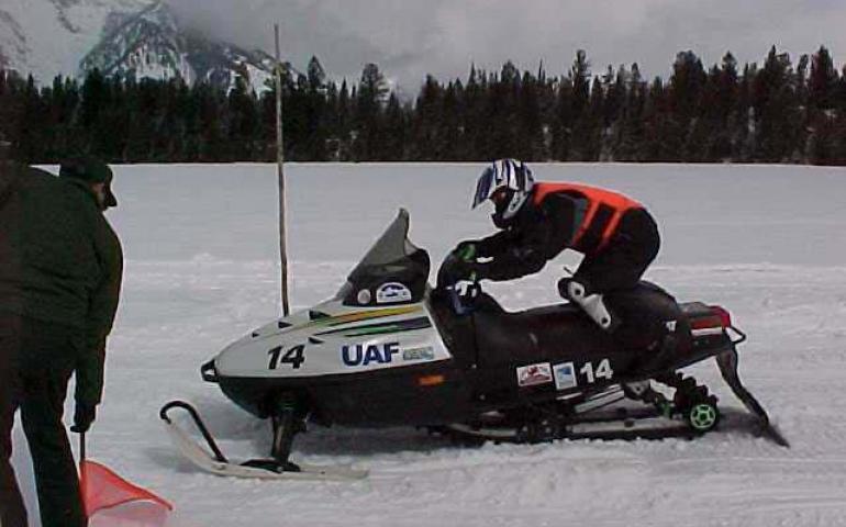  Edwin Dale Hahn takes off from the starting line in an acceleration and noise test during the Clean Snowmobile Challenge, held in late March, 2001 outside Yellowstone National Park. The UAF team of Hahn and Jason Rohwer finished with the second-quietest machine in the collegiate competition. -Jason Rohwer photo. 