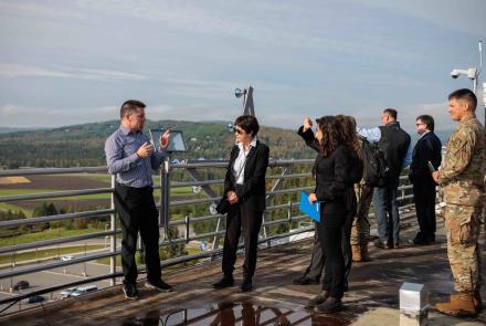 U.S. Undersecretary of Defense Heidi Shyu, center, listens to Alaska Satellite Facility Director Wade Albright on top of the Elvey Building on Aug. 24. Shyu toured the Elvey Building and also the Alaska Center for Unmanned Aircraft Systems Integration hangar. UAF/GI Photo by Courtney Holtzclaw.
