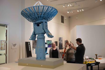 Roger Topp, right, and his team discuss the setup for a model of the antenna that sits atop the University of Alaska Fairbanks Elvey Building. UAF/GI photo by Bryan Whitten