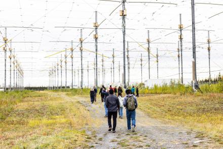 Visitors at the 2022 HAARP open house walk to the facility’s 33-acre antenna array. UAF/GI photo