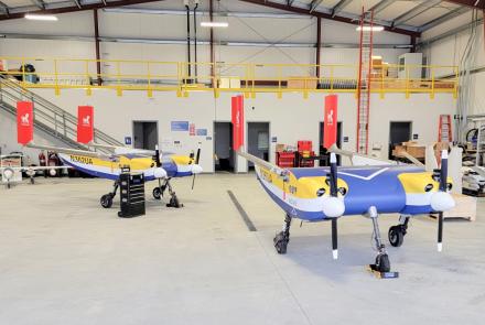 Two Windracers ULTRA aircraft, which ACUASI purchased to test cargo deliveries and emergency responses to remote Alaska locations, occupy a hangar in Nenana. Photo by Jason Williams/ACUASI
