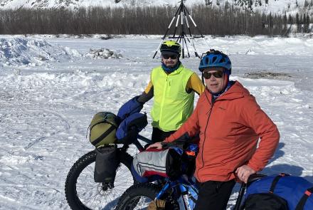 Forest Wagner, left, and Ned Rozell pause in front of the tripod on the ice of the Tanana River at the town of Nenana. When river ice breaks up, whoever guesses the exact time the tripod falls and pulls a cable will be the winner of the Nenana Ice Classic. Photo by Ned Rozell.