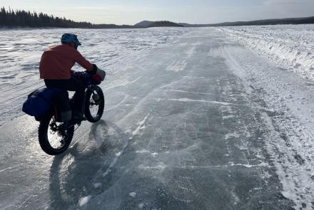 Ned Rozell rides a plowed winter road on the Yukon River that allows cars and trucks to drive between Manley Hot Springs and the village of Tanana in the winter. Photo by Forest Wagner.