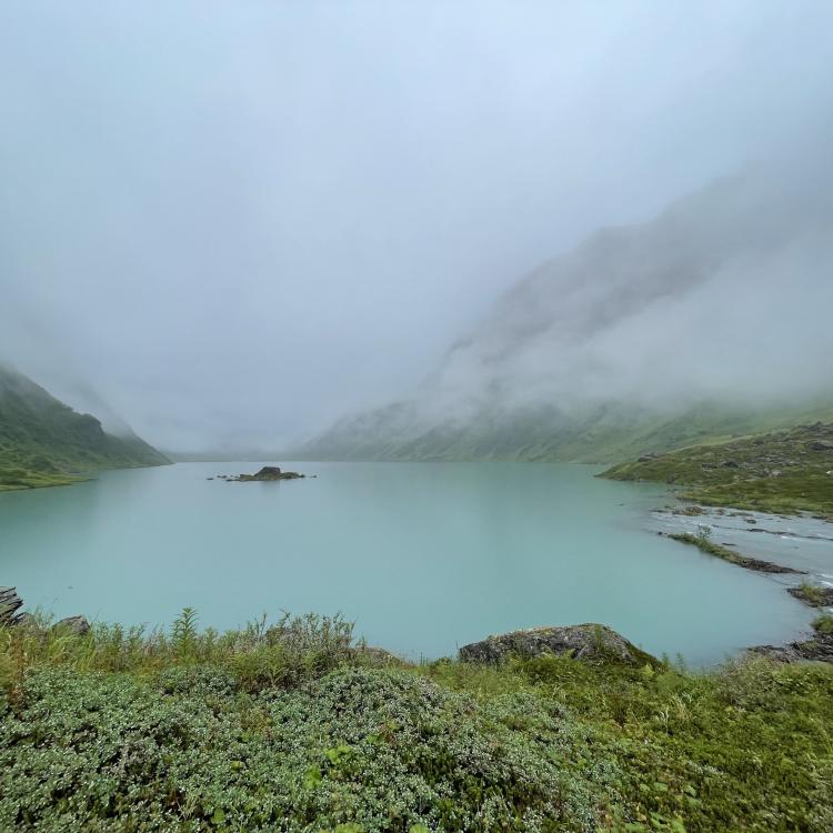 A steady rain falls on Allison Lake, a basin perched above Valdez in the Chugach Mountains. Photo by Ned Rozell.