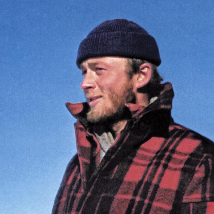 Carl Benson pauses during one of his traverses of Greenland in 1953, when he was 25. Photo courtesy of the UAF Geophysical Institute.