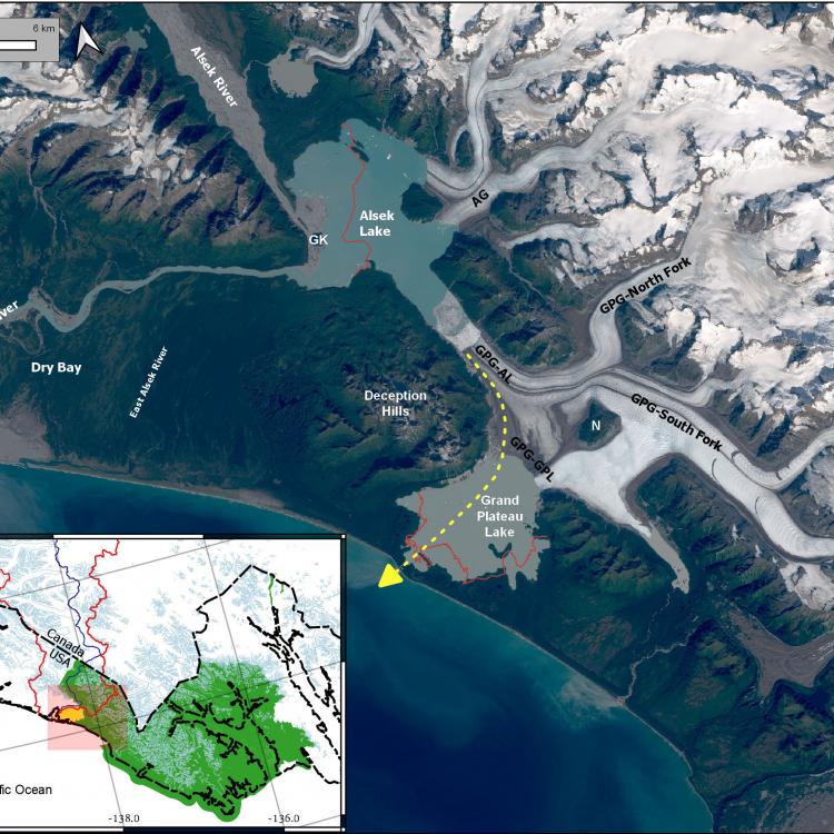 A satellite image showing the Alsek River and Grand Plateau Glacier in southern Alaska. The yellow dashed line represents where the Alsek River may soon flow due to extreme melting of Grand Plateau Glacier (labeled GPG). In the early 1900s, Alsek Glacier (AG) was connected to Grand Plateau Glacier. 