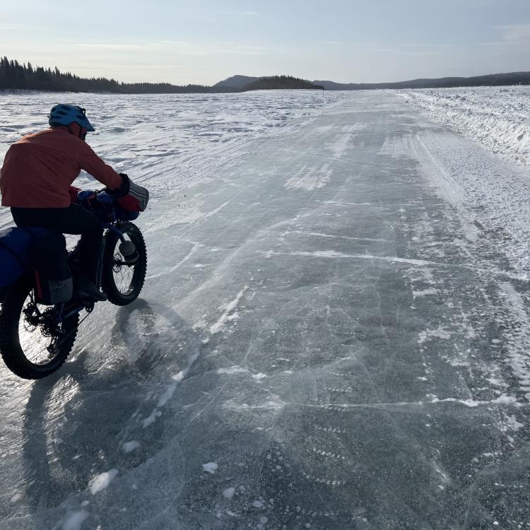 Ned Rozell rides a plowed winter road on the Yukon River that allows cars and trucks to drive between Manley Hot Springs and the village of Tanana in the winter. Photo by Forest Wagner.