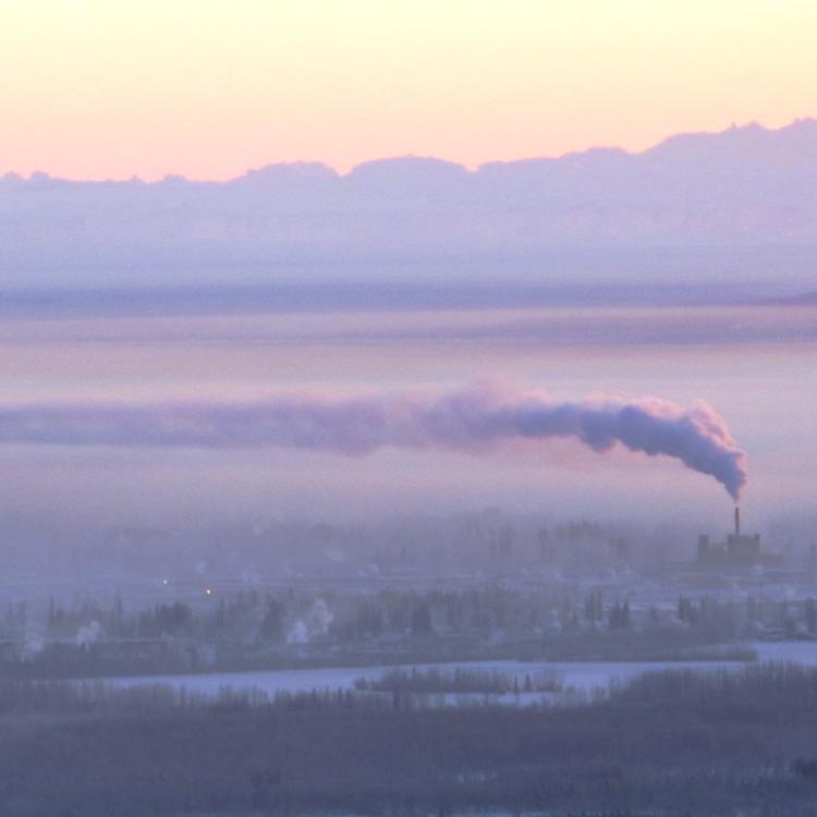 Downtown Fairbanks is blanketed in ice fog beneath the exhaust of a coal-fired power plant in January 2012. Photo by Ned Rozell.
